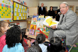 Supervisor Knabe reads a book to children at Mayne Street Preschool in Bellflower